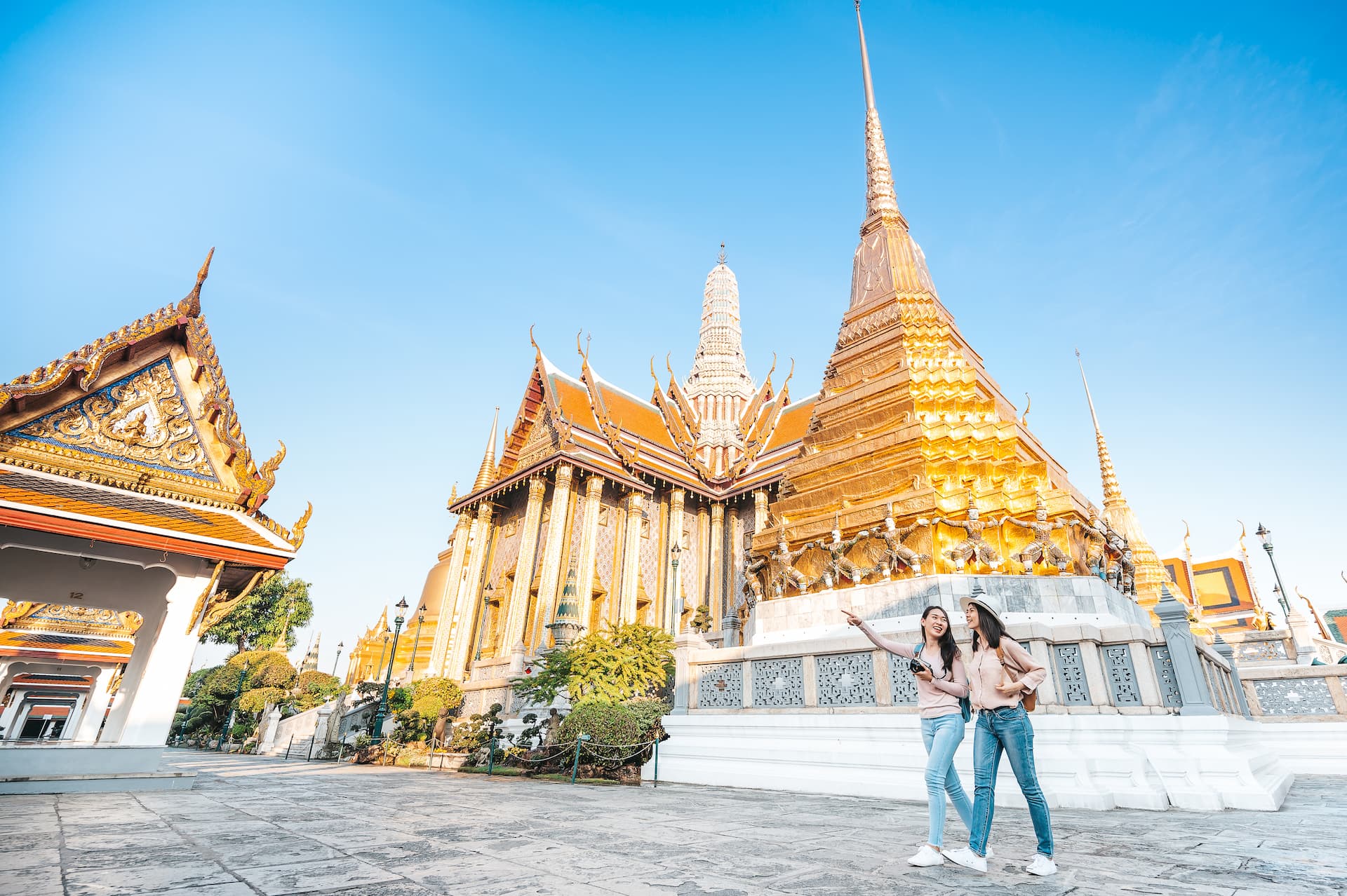 women-friends-enjoy-sightseeing-while-travel-temple-emerald-buddha-thailand.jpg